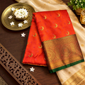 City Center red Banarasi silk saree featuring gold crescent moon motifs and an ornate traditional zari border.