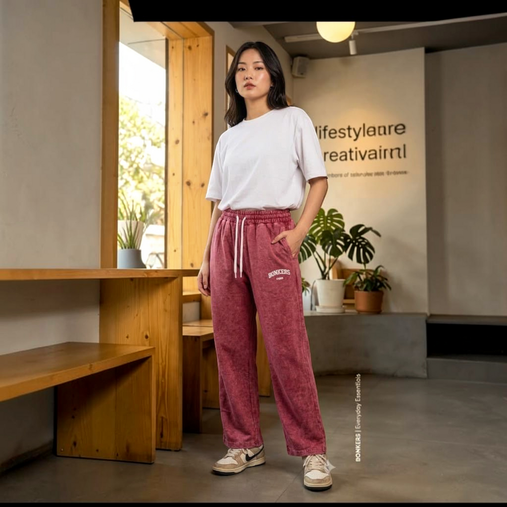 City Center premium Korean-style maroon acid-wash sweatpants with a white t-shirt worn by a woman in a cafe