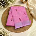 City Center pink linen cotton saree featuring delicate floral butti embroidery and a subtle silver border.