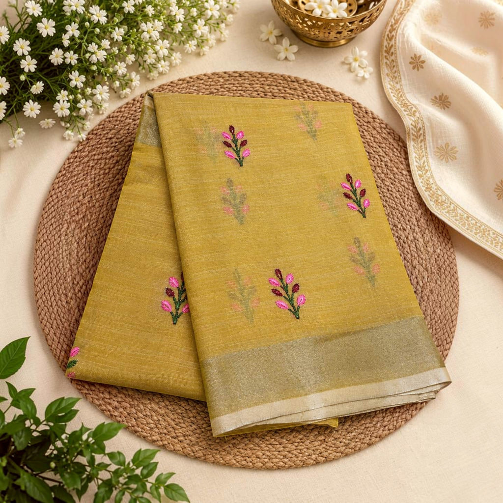 City Center mustard yellow linen cotton saree with delicate pink and green floral butti embroidery and silver border