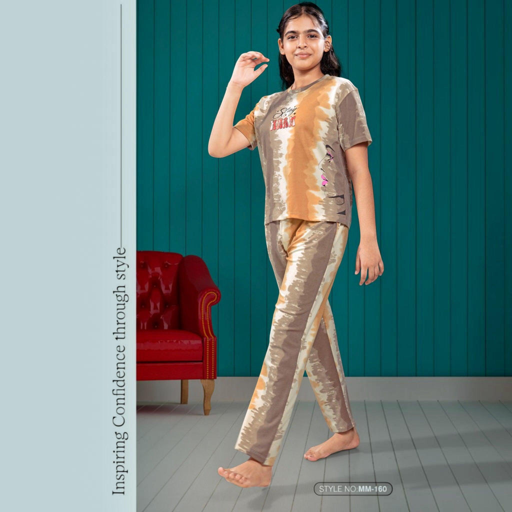 City Center Mawa Girl tie-dye cord set featuring a brown and beige short-sleeve top and matching trousers on a girl.