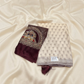 City Center Radha Rani saree in cream with a deep maroon embroidered blouse piece featuring intricate peacock motifs