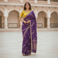 City Center purple organza saree with intricate beadwork and a contrasting yellow embroidered blouse worn by a model.