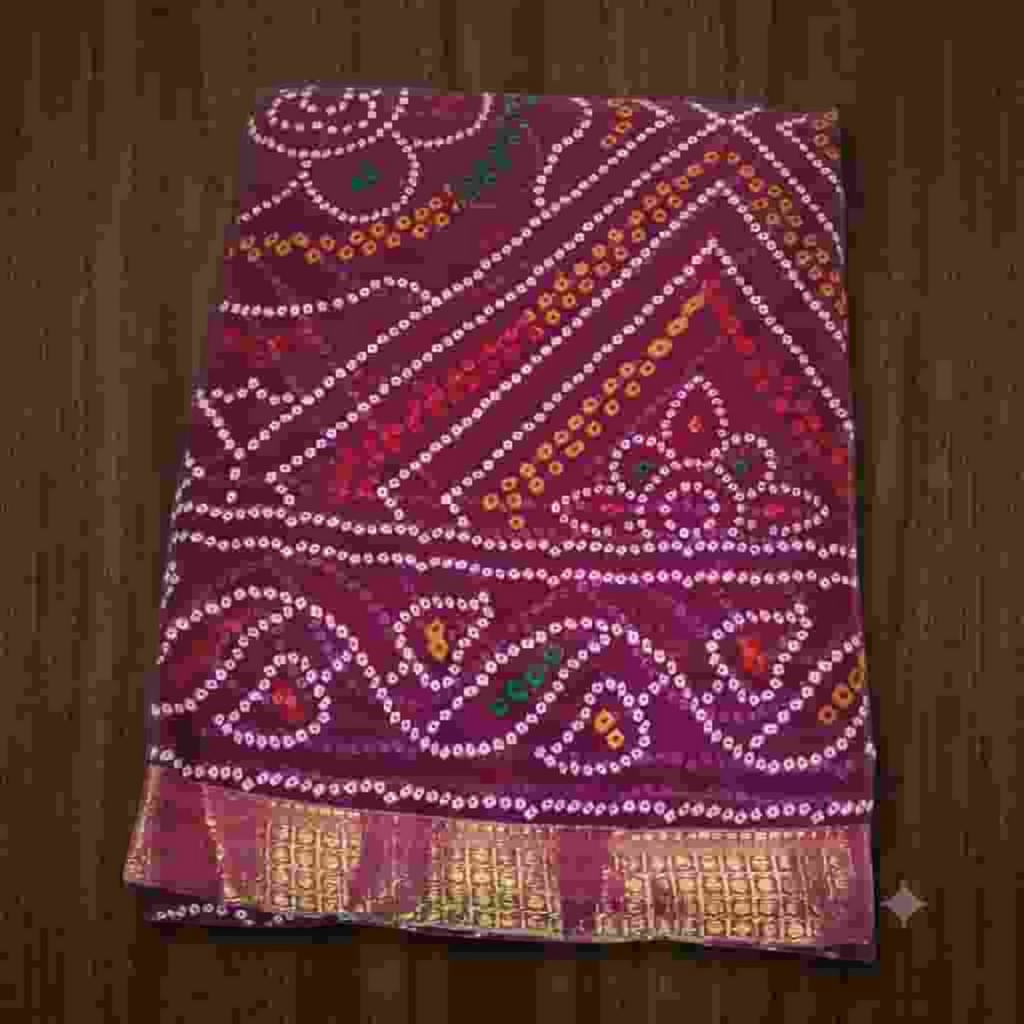 City Center Bandhan silk saree in deep maroon with traditional white bandhani tie-dye patterns and a gold zari border.