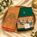City Center designer saree in emerald green with a contrasting orange blouse featuring intricate peacock embroidery