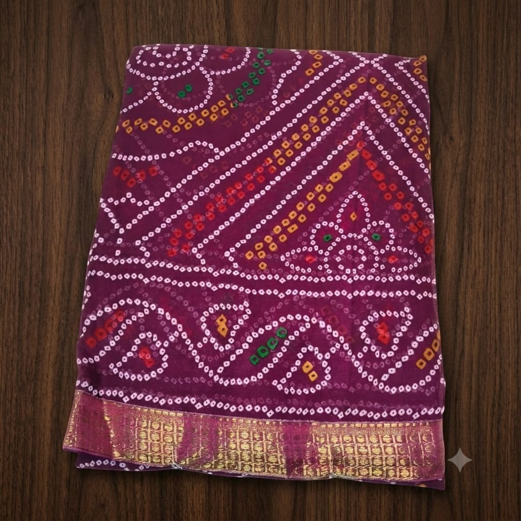 City Center Bandhan silk saree in deep purple with traditional multi-colored bandhani tie-dye and gold woven border.