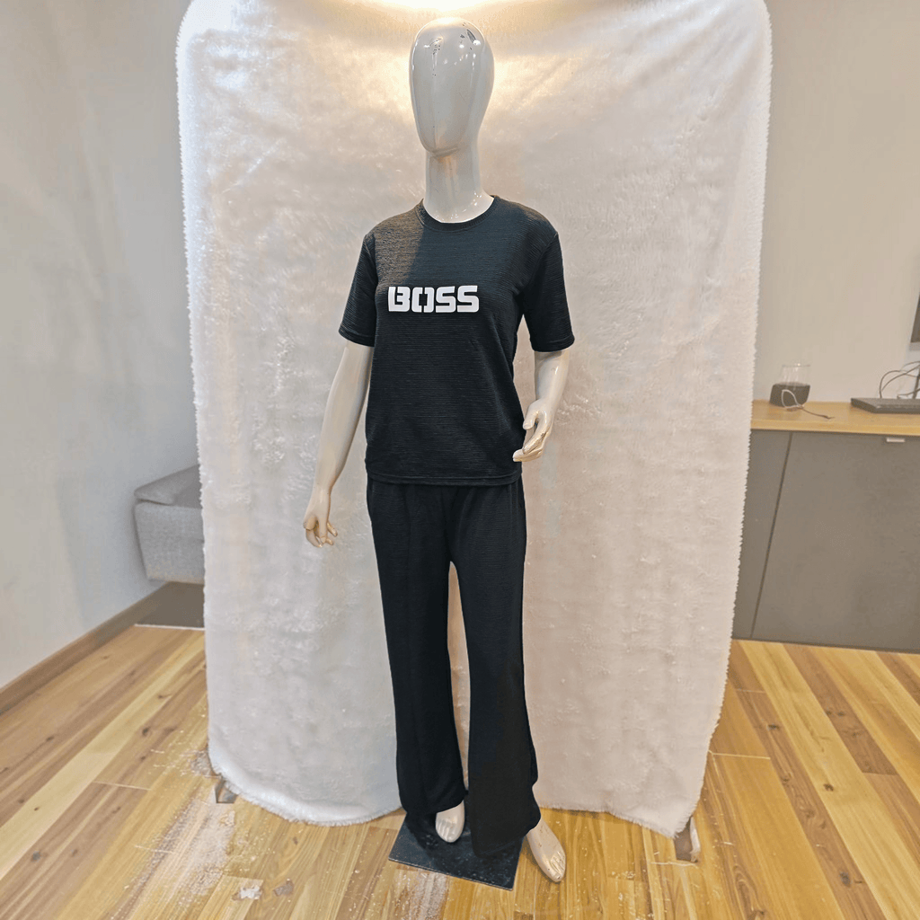 City Center black Korean airport cord set with BOSS graphic on a mannequin, featuring wrinkle-free soft-blend fabric.
