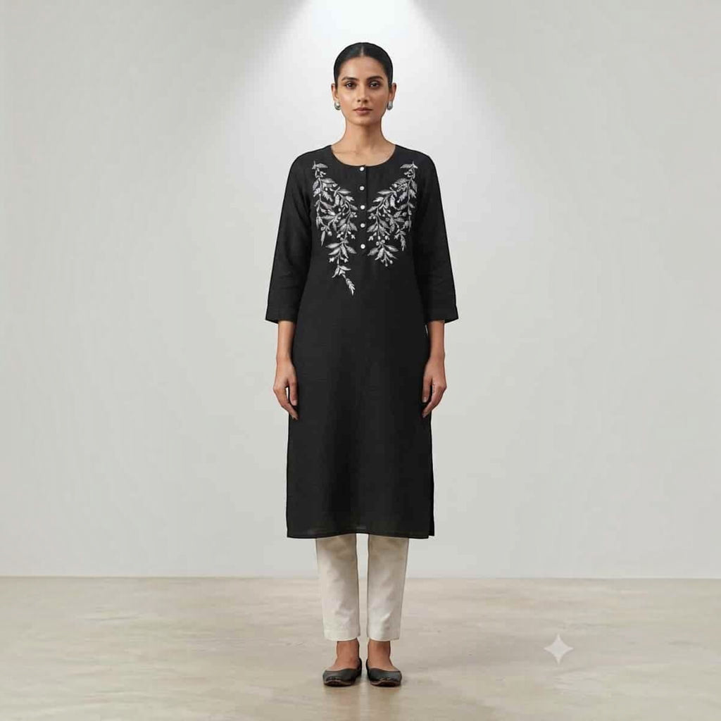 City Center black knee-length Lodgy kurti with white floral embroidery, worn by a model with beige trousers.