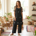 City Center black co-ord set with white floral embroidery, sleeveless top with tie-shoulders, and matching trousers.