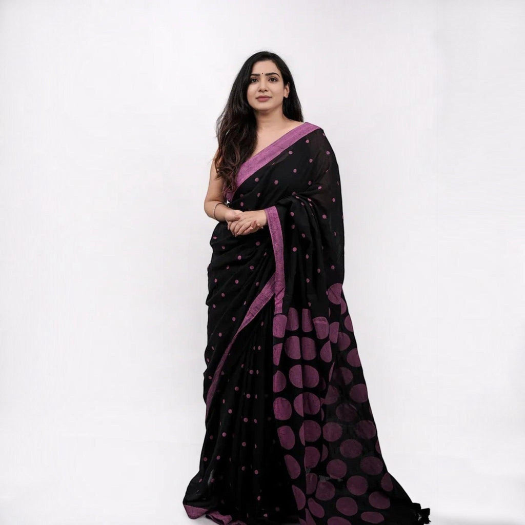 City Center premium cotton saree in black with purple polka dots and a matching border worn by a woman