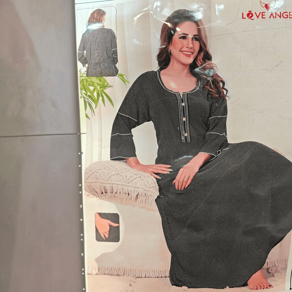 City Center heavy rayon A-line gown in black with white polka dots, featuring three-quarter sleeves and button detail.