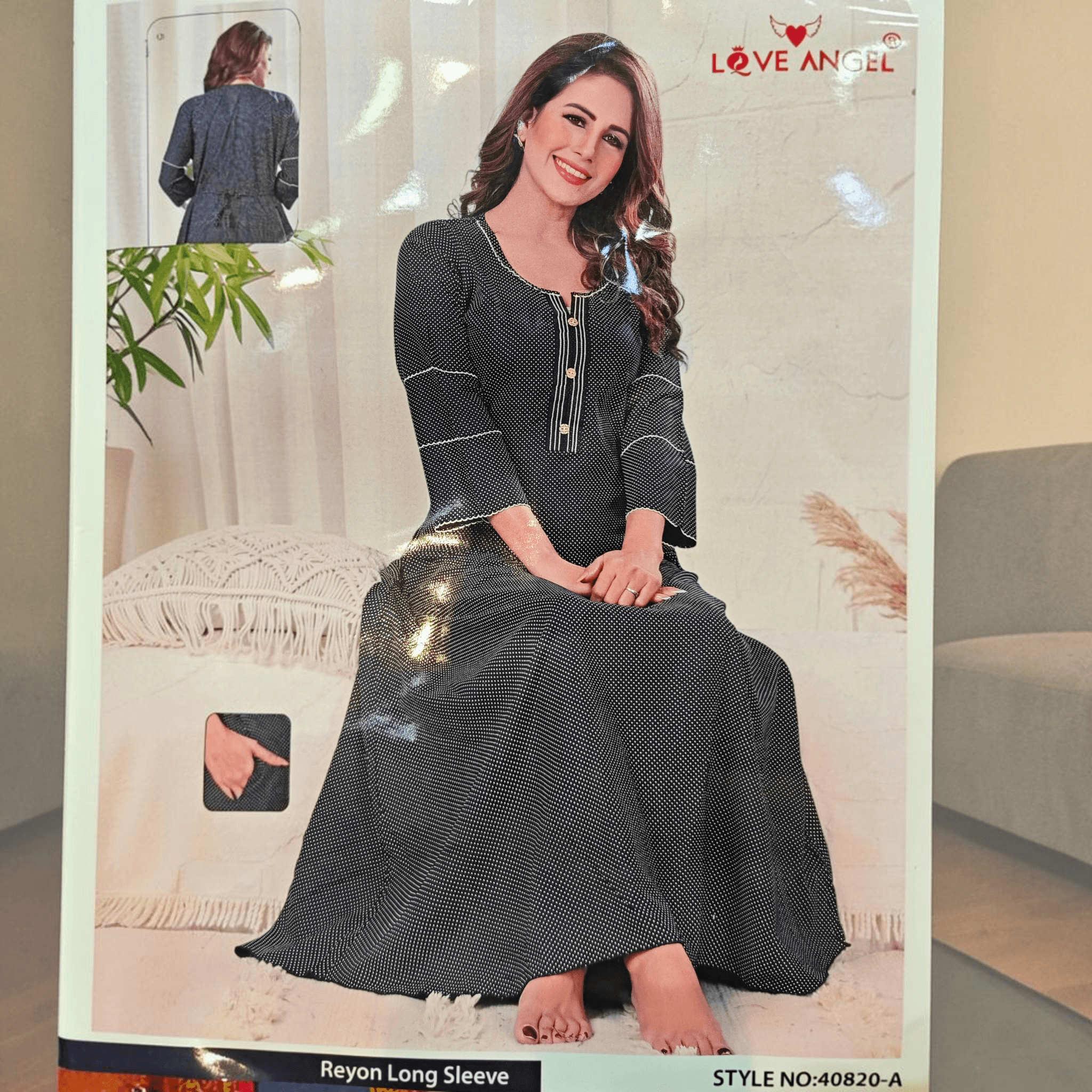 City Center black A-line rayon gown with white polka dots, three-quarter sleeves, and button-down neckline detail.