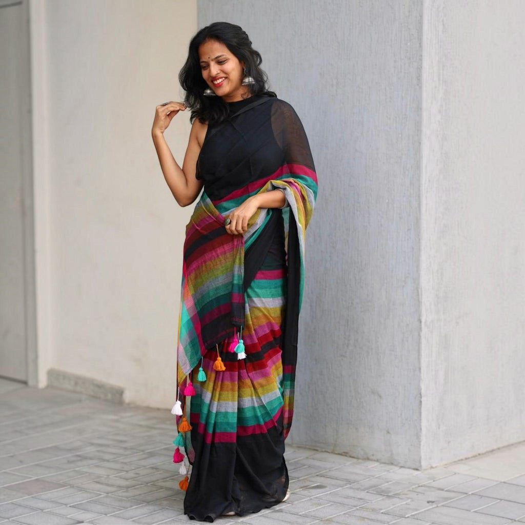 City Center premium cotton saree in black with a vibrant multi-colored striped pallu and playful tassel details.