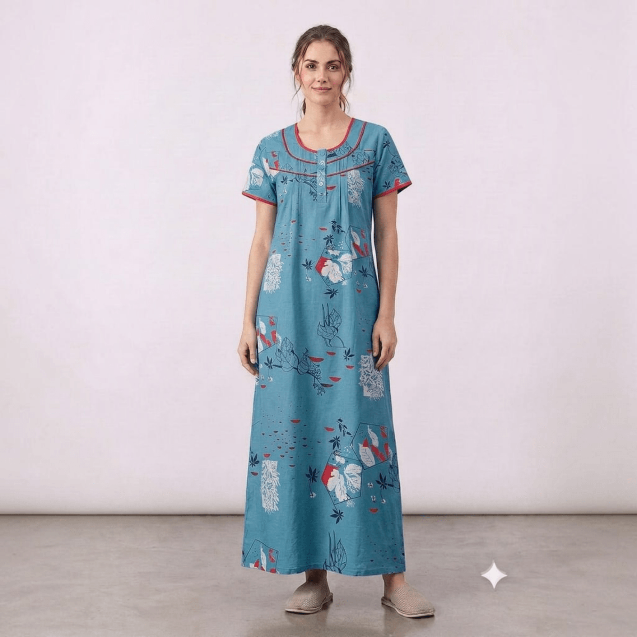 City Center women's blue alpine fabric feeding gown with red trim, floral print, and front pleats.