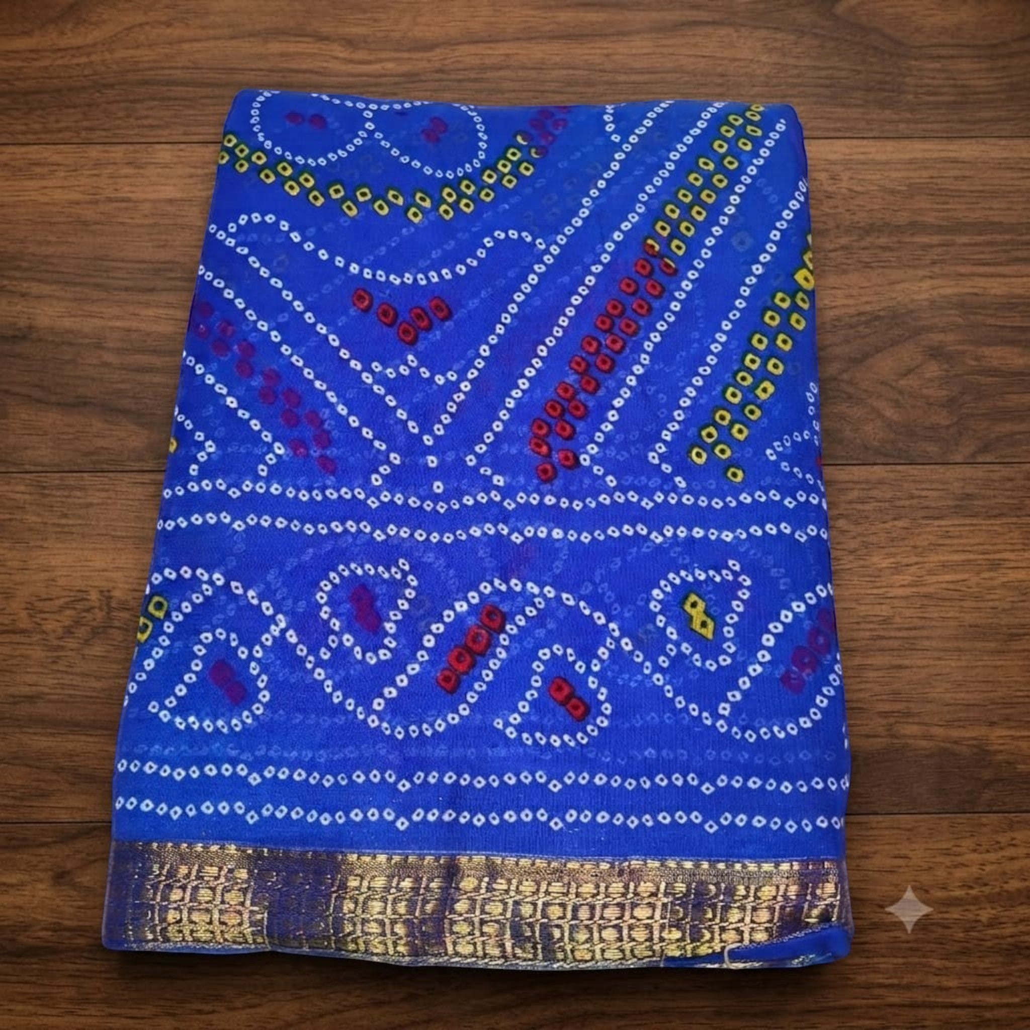 City Center Bandhan silk saree in vibrant blue with traditional bandhani patterns and a gold woven border.