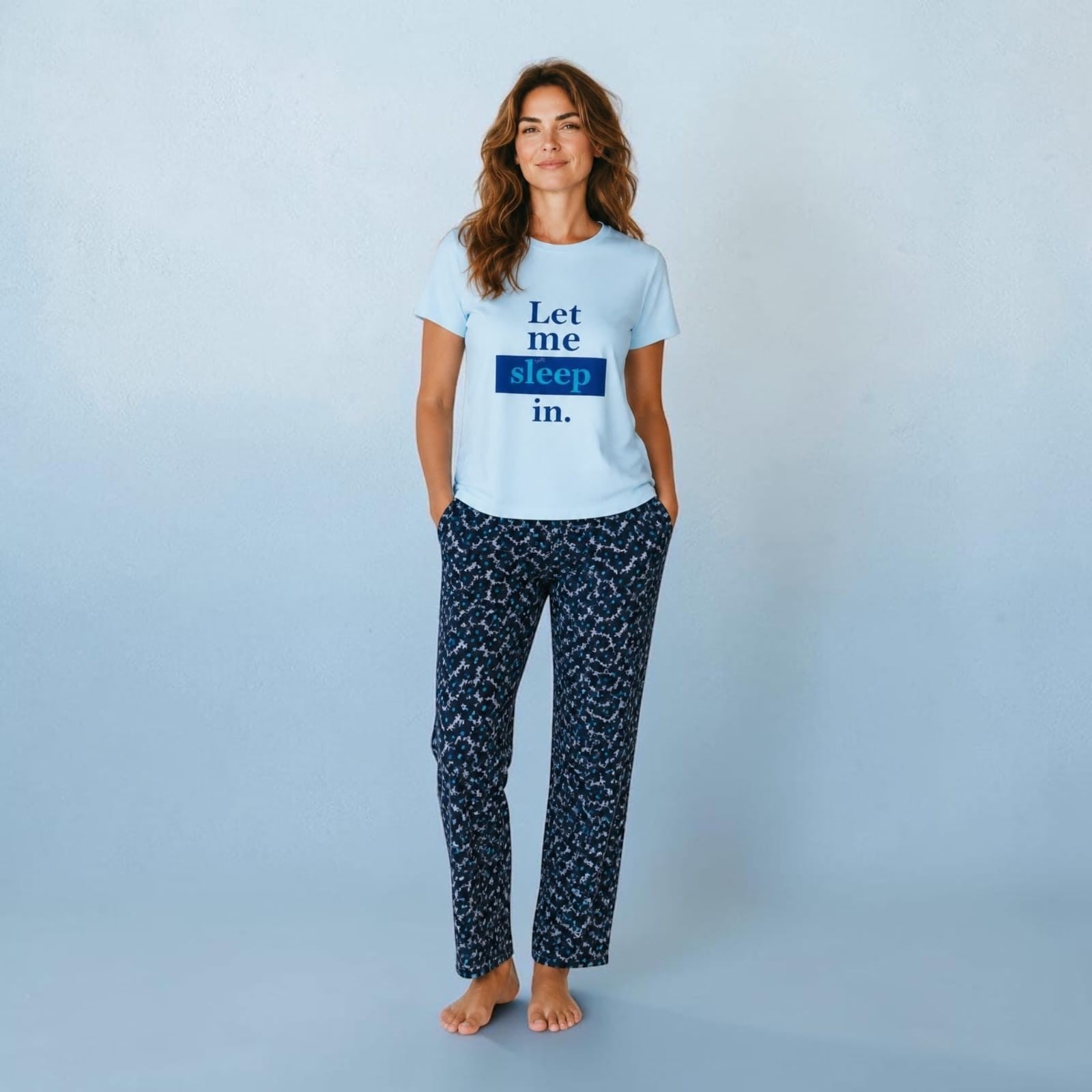 City Center co-ord set featuring a light blue t-shirt with Let me sleep in text and patterned dark blue trousers.