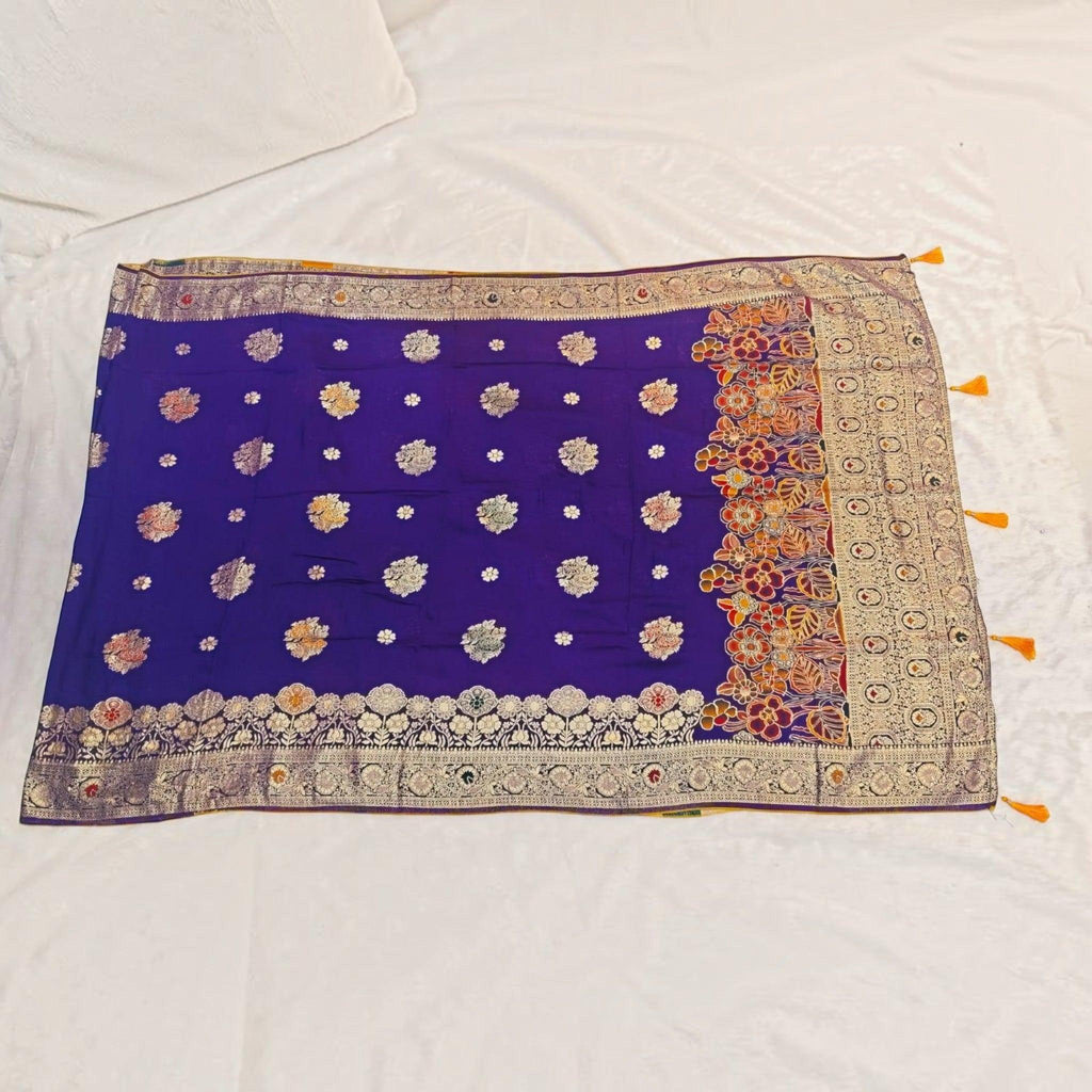City Center royal blue Dola silk saree with intricate gold zari floral motifs and a decorative multi-colored border.
