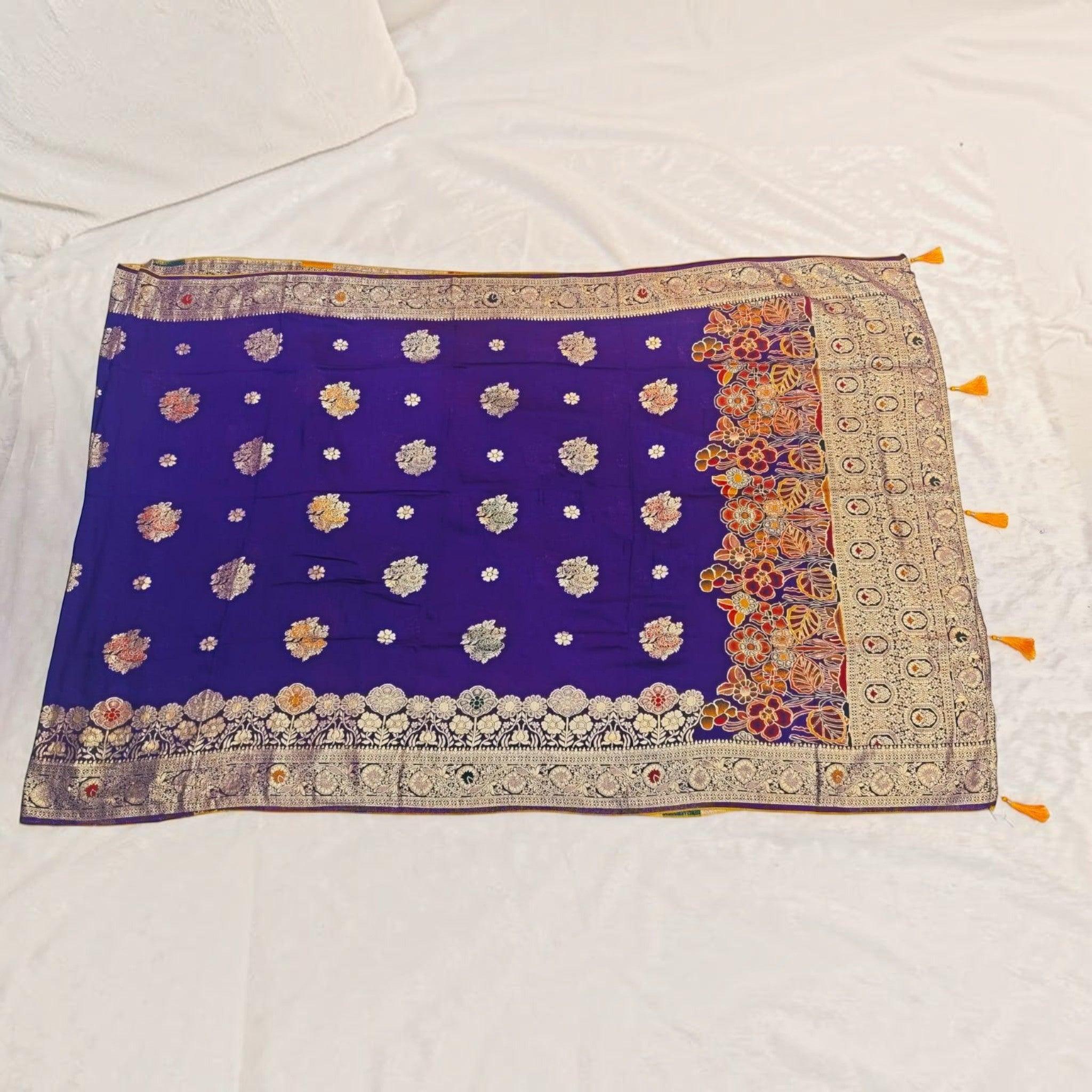 City Center royal blue Dola silk saree with intricate gold zari floral motifs and a decorative multi-colored border.