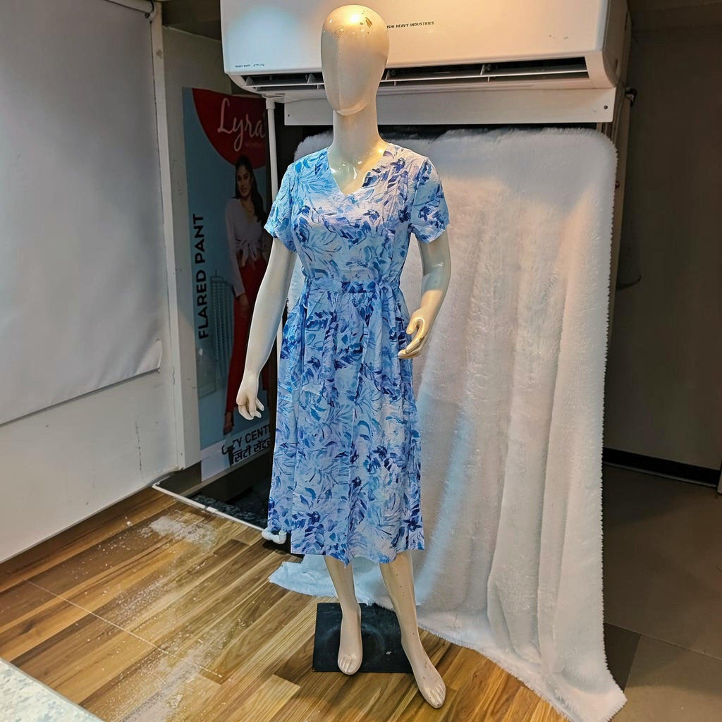 City Center blue floral print midi dress with v-neck and short sleeves on a mannequin in a retail setting