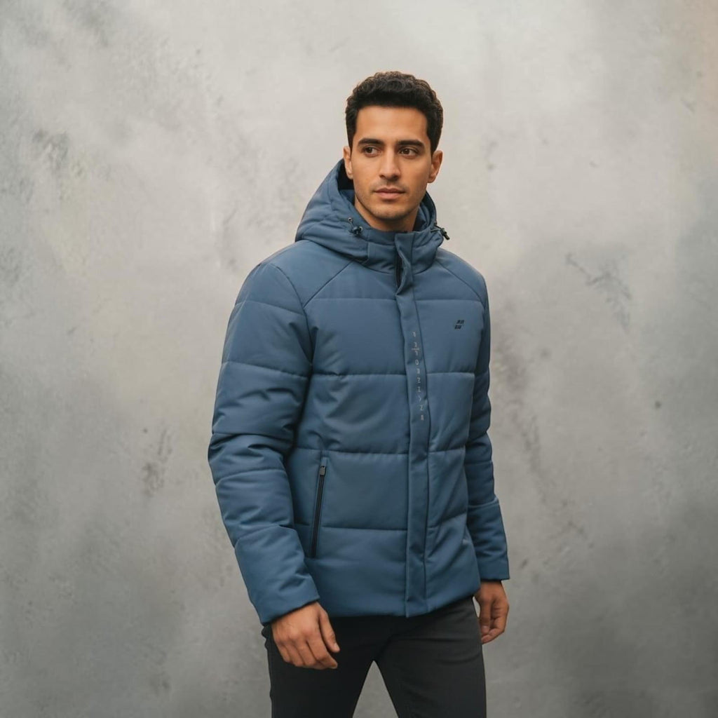 City Center men's blue hooded puffer jacket with zip pockets and modern tailored fit worn by a model