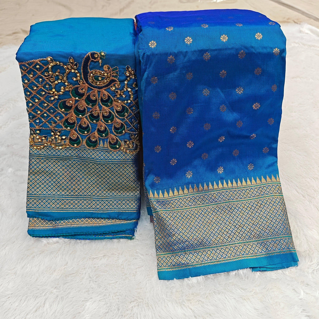 City Center blue Kalanjali silk saree with gold woven border and matching blouse featuring intricate peacock Aari work