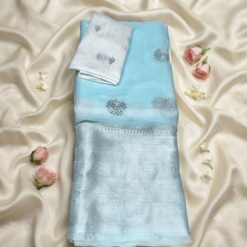 City Center light blue organza saree with silver embroidery and a matching contrast blouse piece on satin fabric.