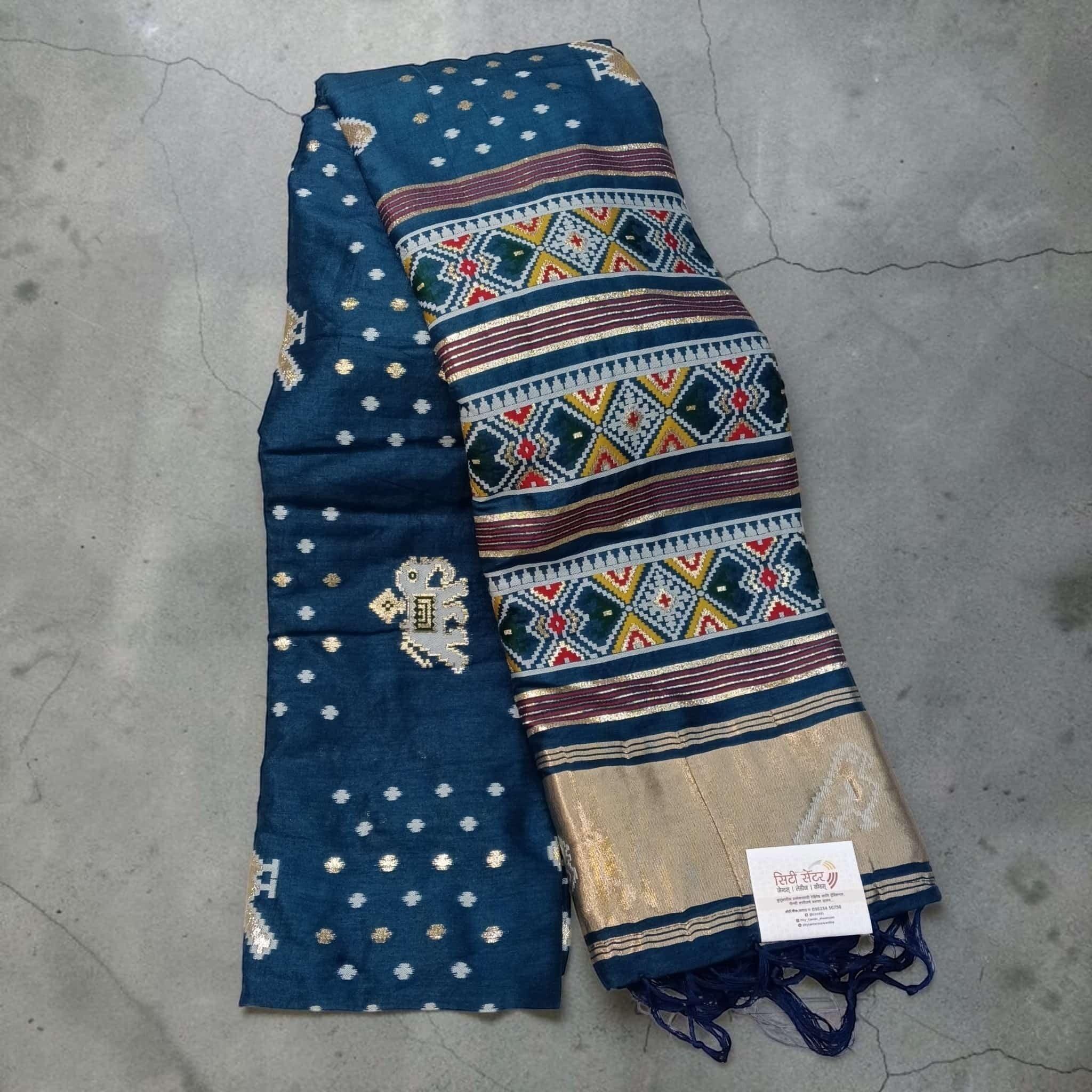City Center blue silk cotton saree with traditional Patola double-ikat geometric patterns and gold zari border