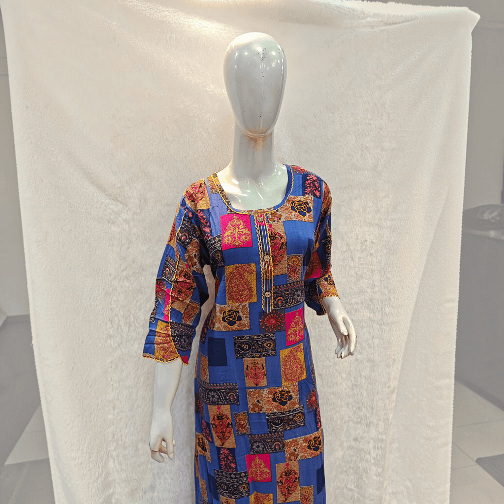 City Center heavy rayon A-line gown in blue with a vibrant multi-colored patchwork print and three-quarter sleeves.