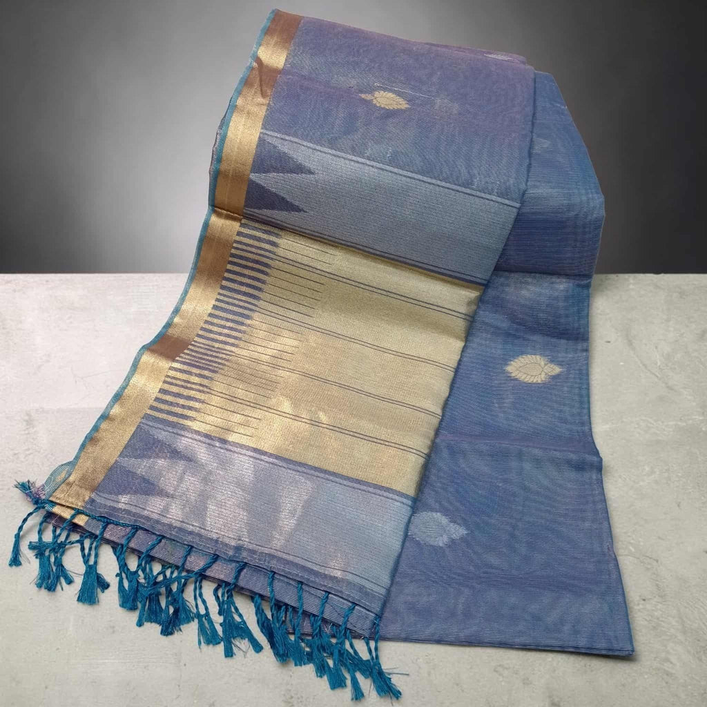 City Center blue tissue cotton saree with gold zari border and delicate leaf motifs, featuring a soft tassel finish.