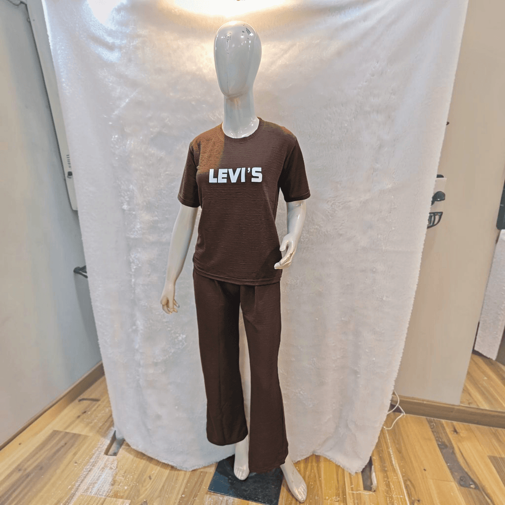 City Center brown Korean airport cord set with a relaxed fit and white logo on a mannequin