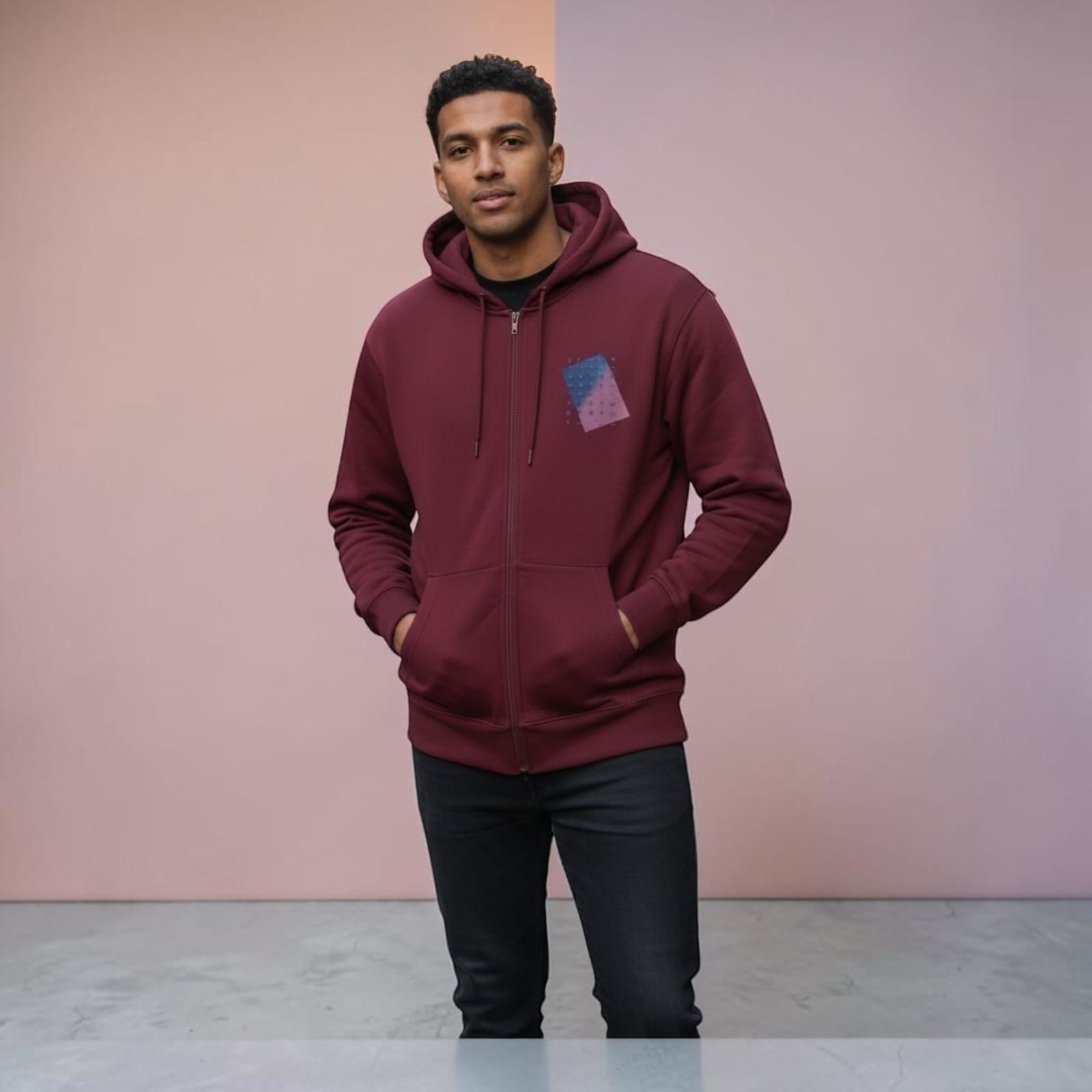 City Center M-LINE men's burgundy full-zip hoodie with kangaroo pockets worn by a man against a two-tone background