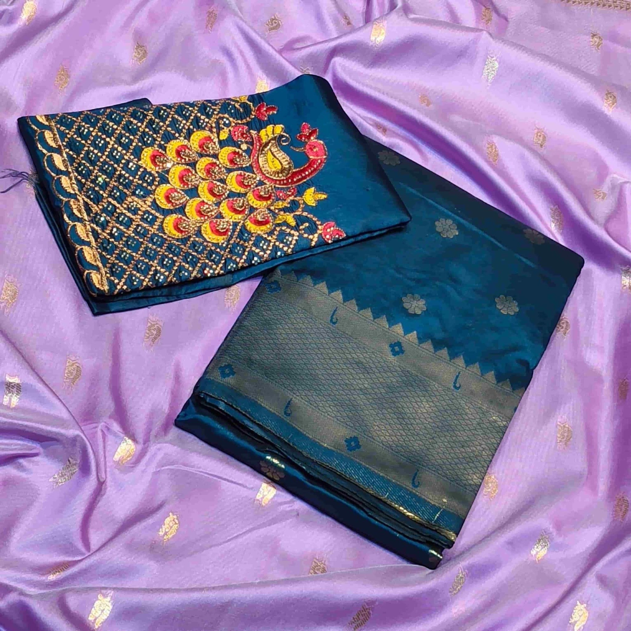 City Center Kalanjali Chandrakala saree in lavender with a teal blouse featuring intricate peacock Aari embroidery.