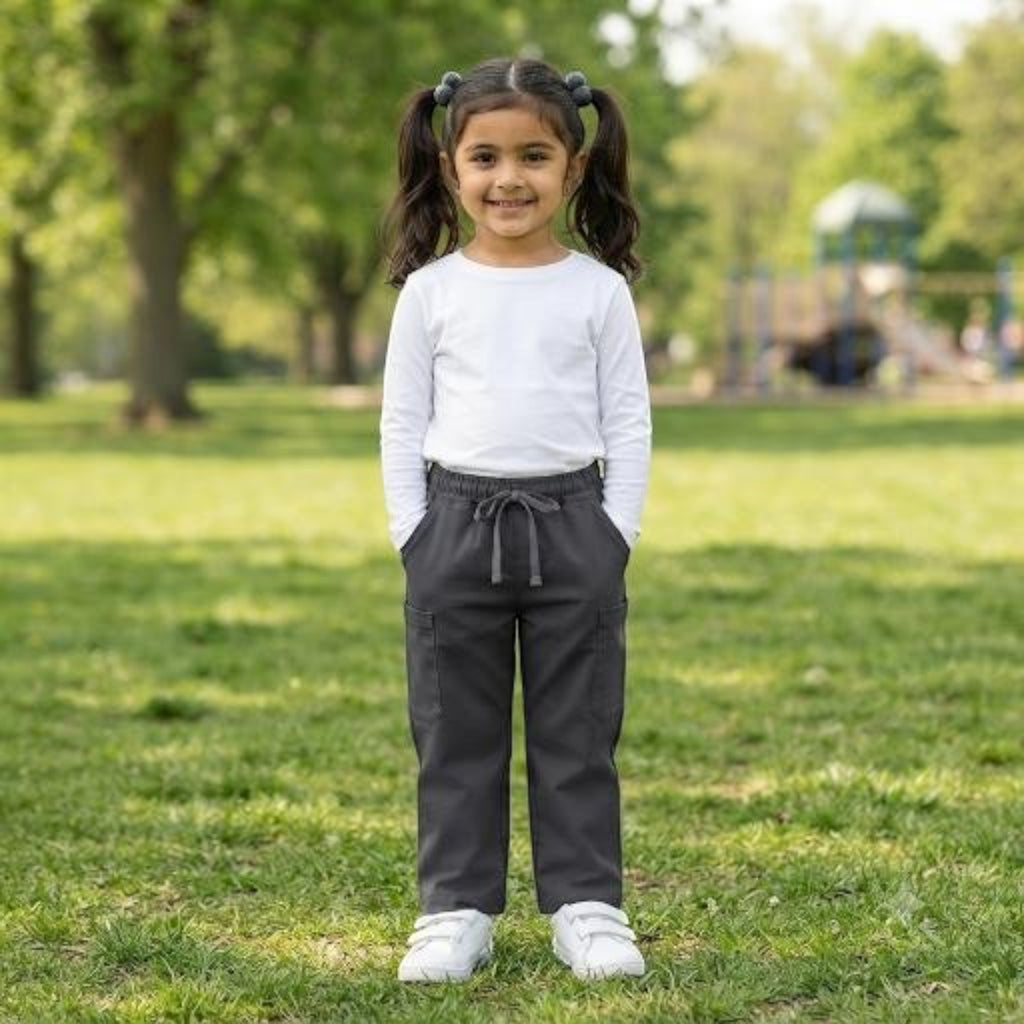 City Center girl wearing charcoal grey ethnic pants with an elasticated drawstring waist in a park setting
