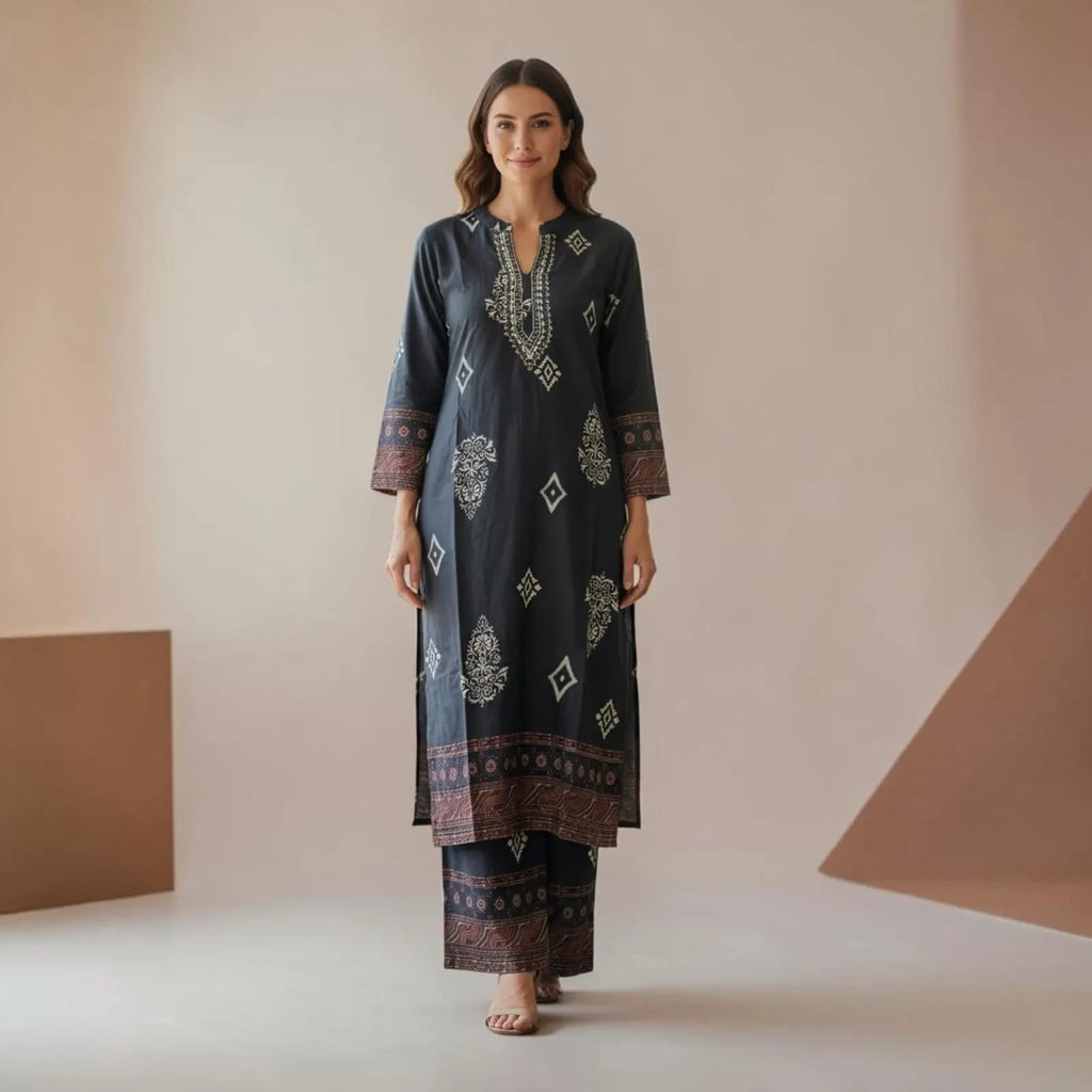 City Center premium dark grey 2-piece co-ord set with intricate white and rust geometric embroidery on a model