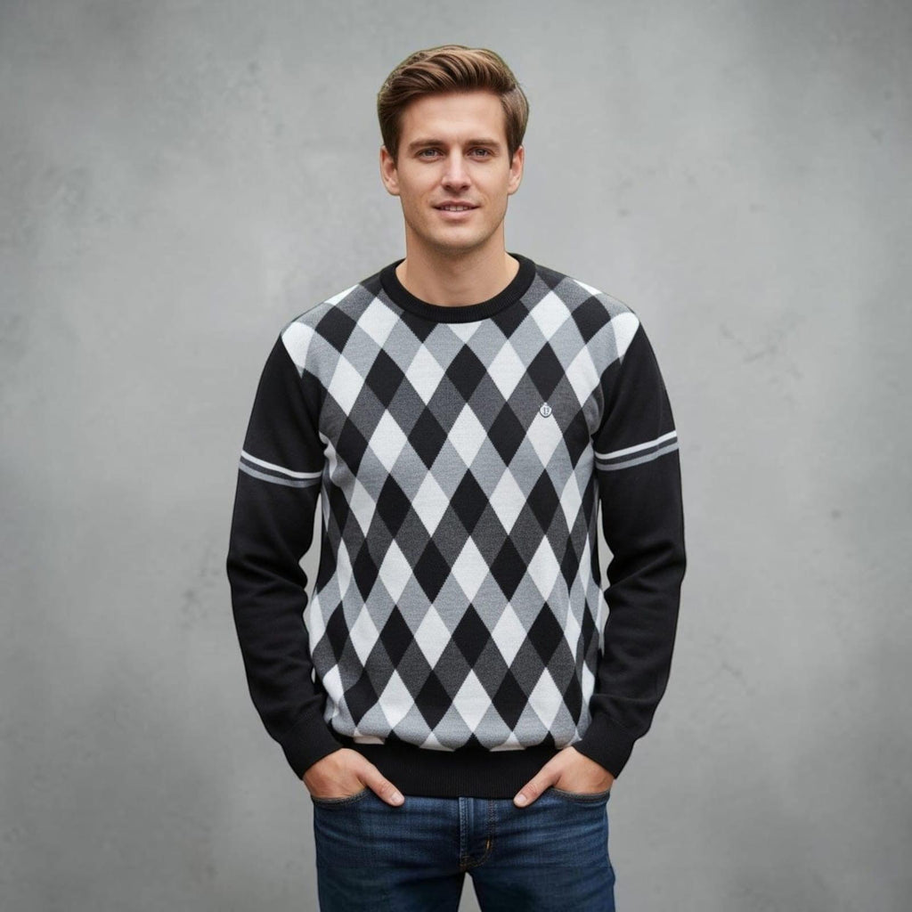 City Center Diamond Touch sweater featuring a black, grey, and white argyle pattern worn by a man with blue jeans.