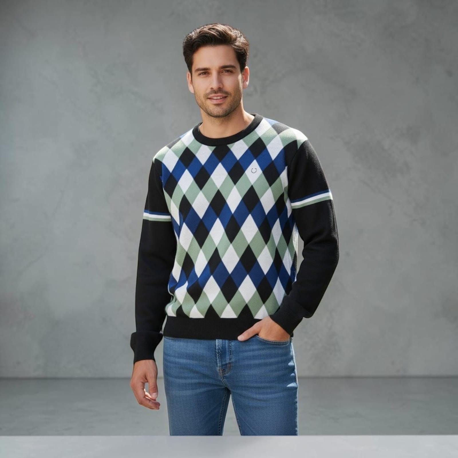 City Center Diamond Touch sweater featuring a blue, green, and black diamond pattern worn by a man with blue jeans.