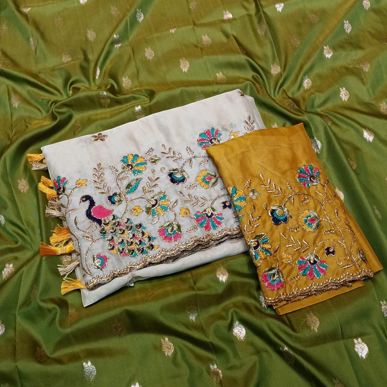 City Center traditional saree in olive green with white and mustard embroidered blouse pieces featuring peacock motifs