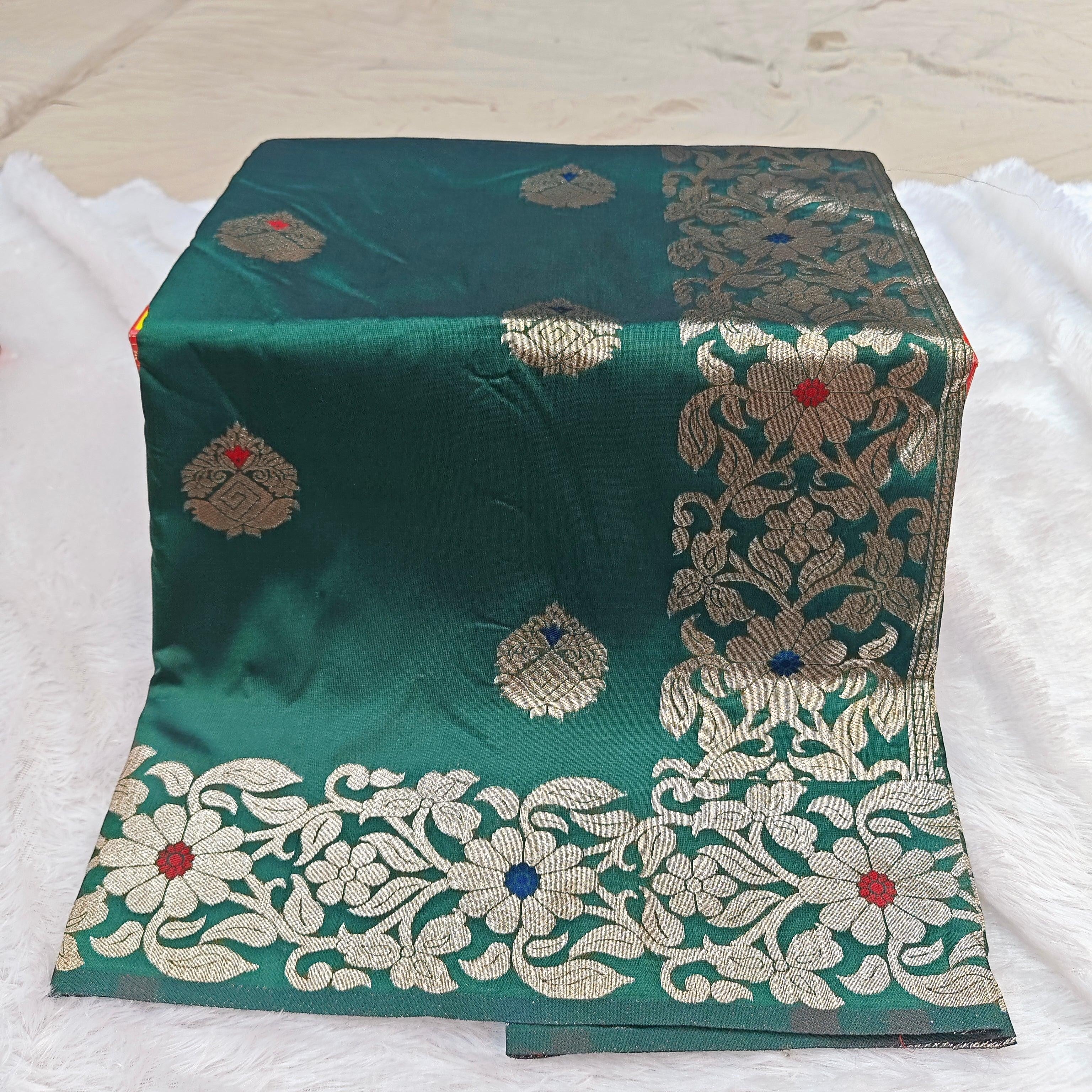 City Center Takshashila silk blend saree in emerald green with intricate gold zari and multi-color floral Mina work.