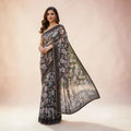 City Center chiffon saree in black with delicate floral prints, featuring a lightweight drape and elegant border.
