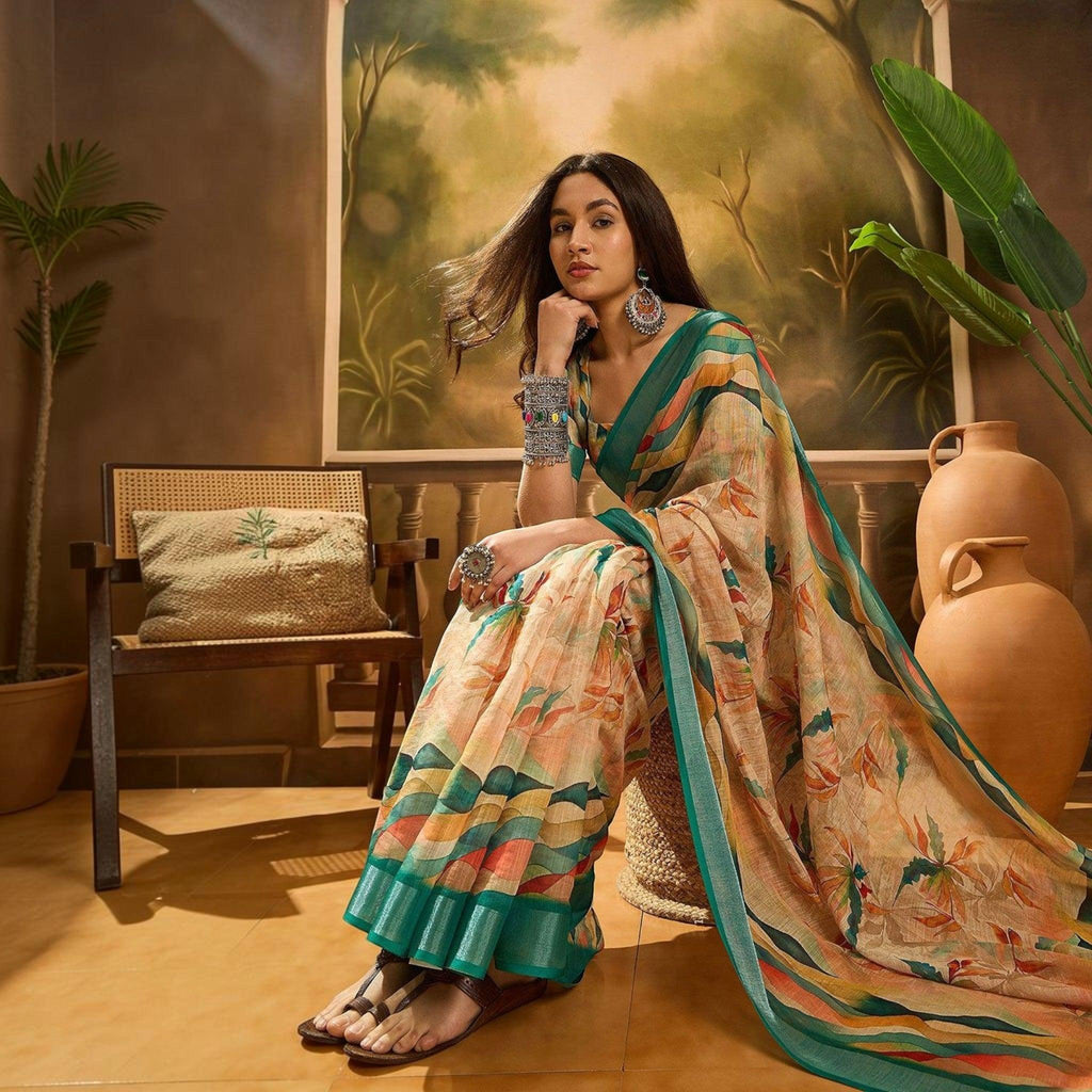 City Center premium cotton saree with floral print, teal border, and matching blouse, worn by a model in a studio.