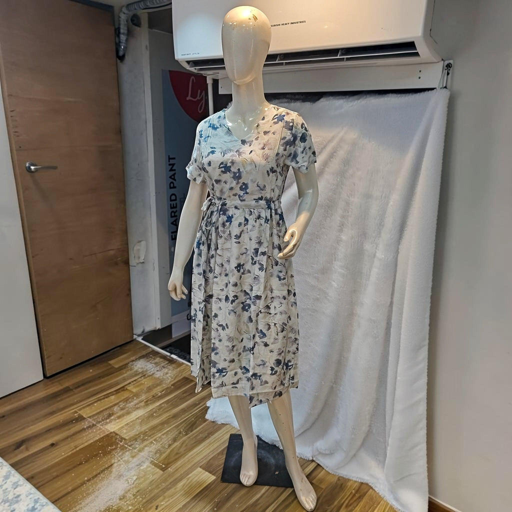 City Center floral print midi dress with a V-neck and cinched waist on a mannequin