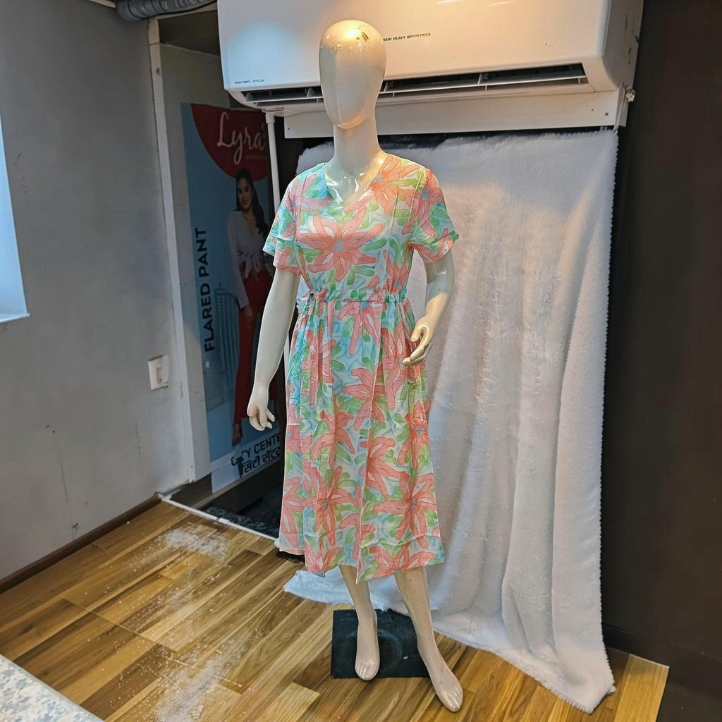 City Center floral print midi dress with short sleeves and a cinched waist on a mannequin