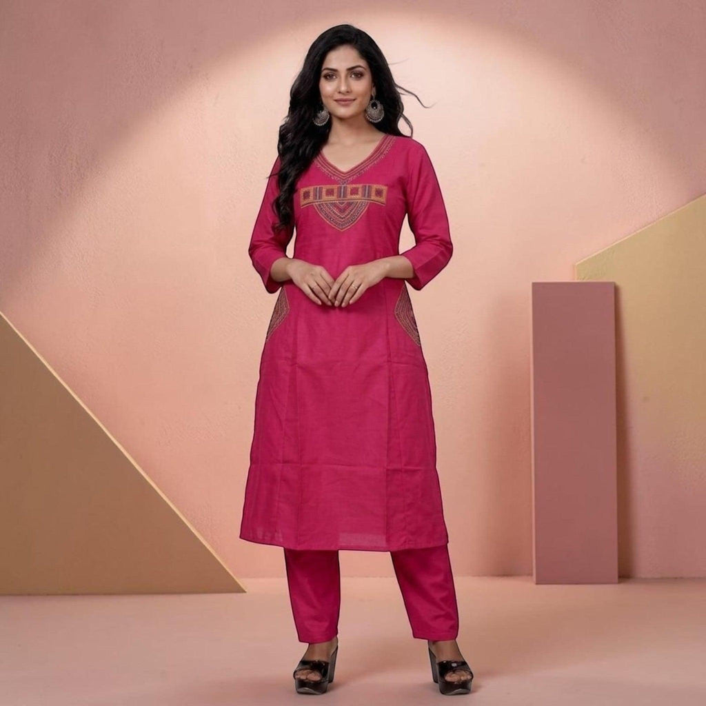 City Center fuchsia pink kurta and pant set with V-neckline and intricate ethnic embroidery on a model