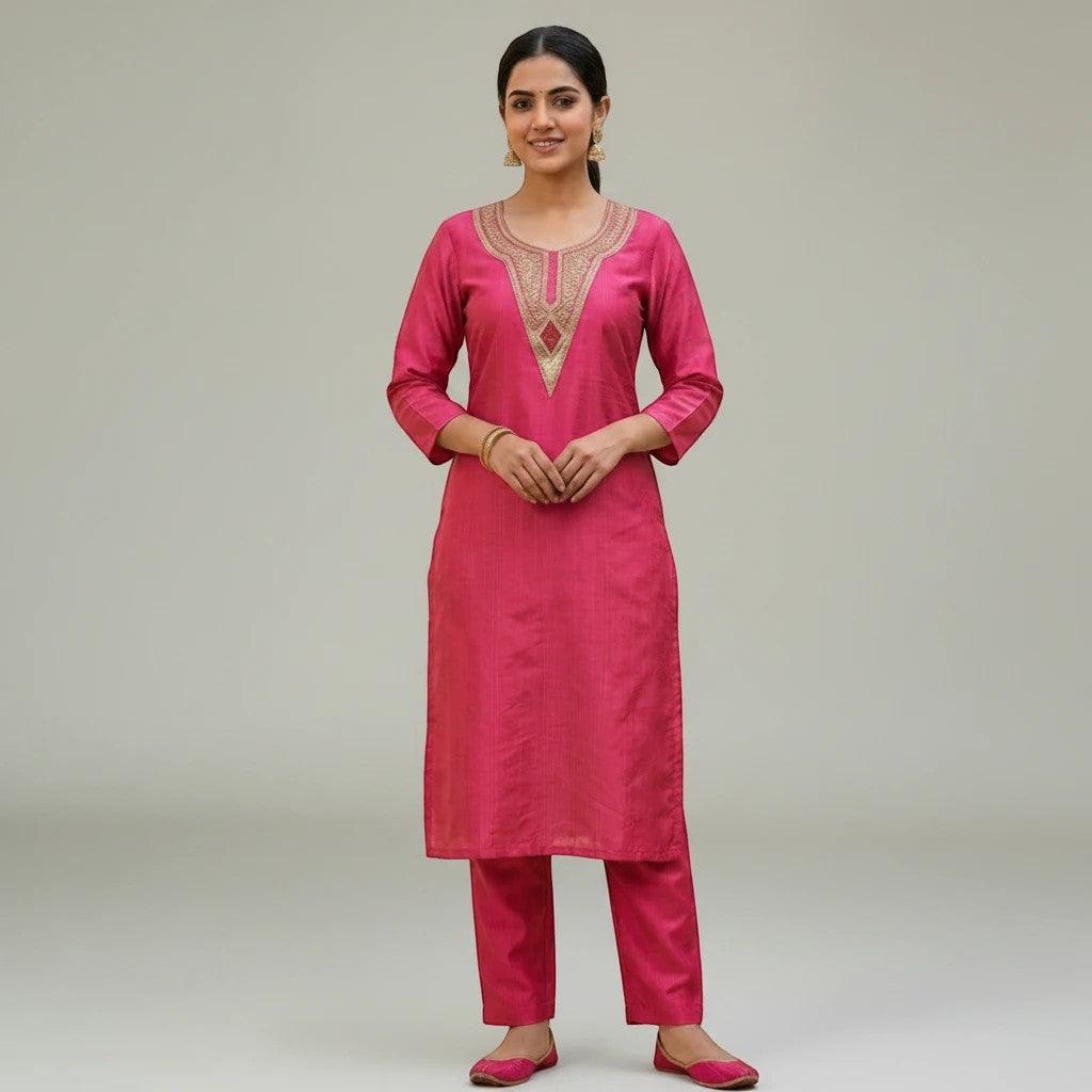 City Center fuchsia pink co-ord set with embroidered neckline and matching trousers on a model