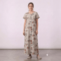 City Center women's beige feeding gown with geometric print, short sleeves, and button-down front in alpine fabric.