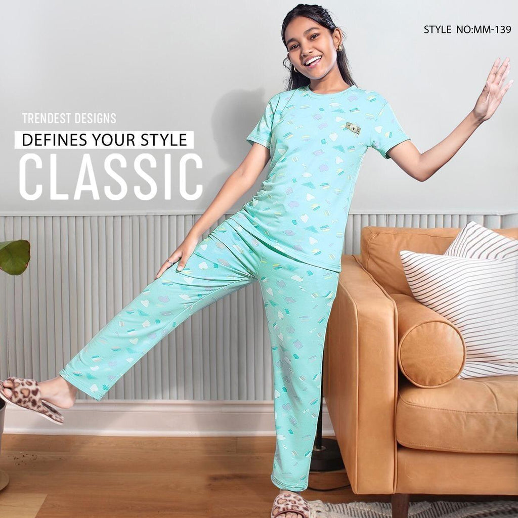City Center girls mint green patterned cord set made from soft imported looper fabric, worn by a smiling girl.