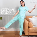 City Center girls mint green patterned cord set made from soft imported looper fabric, worn by a smiling girl.