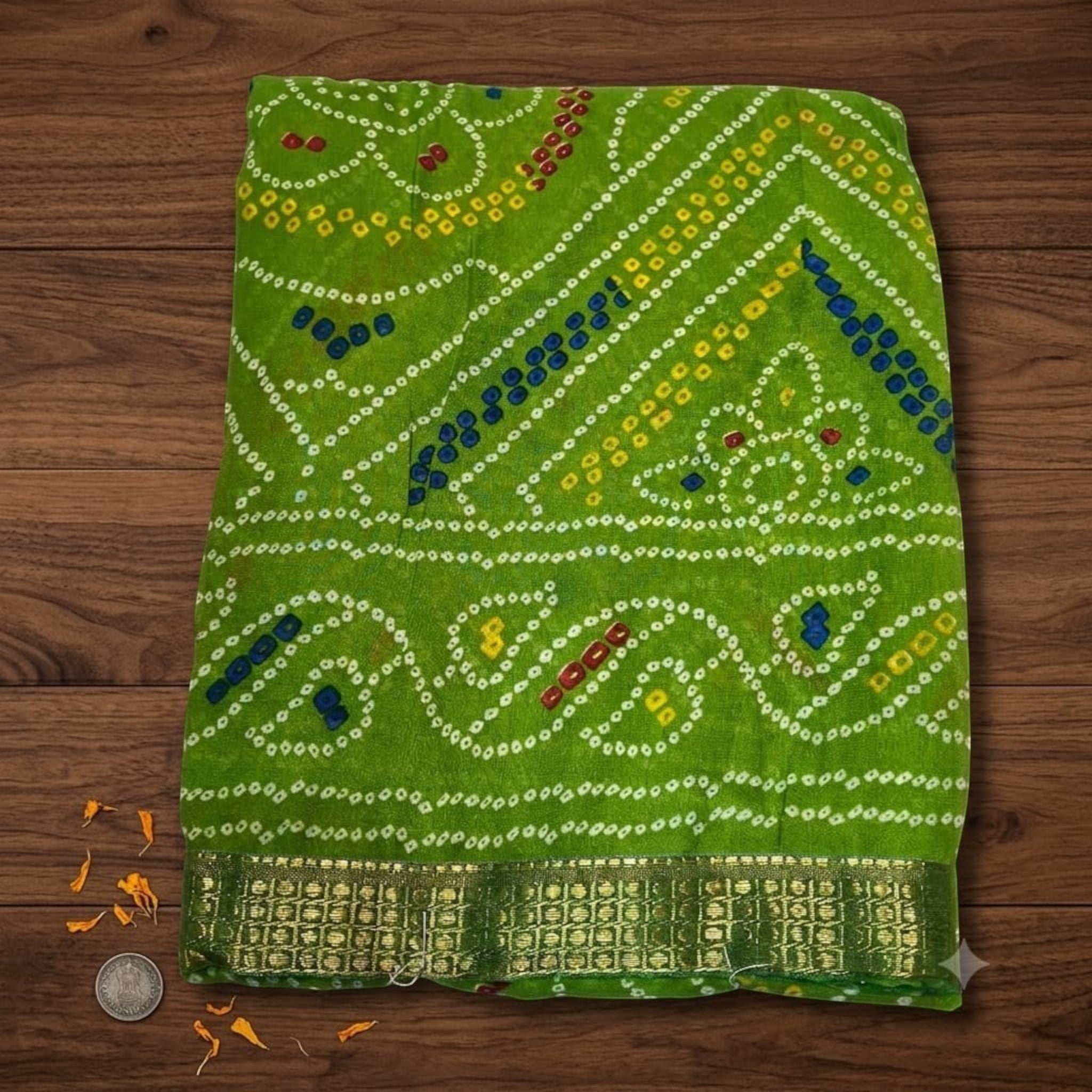 City Center green Bandhan silk saree featuring traditional bandhani tie-dye patterns and a gold woven border.
