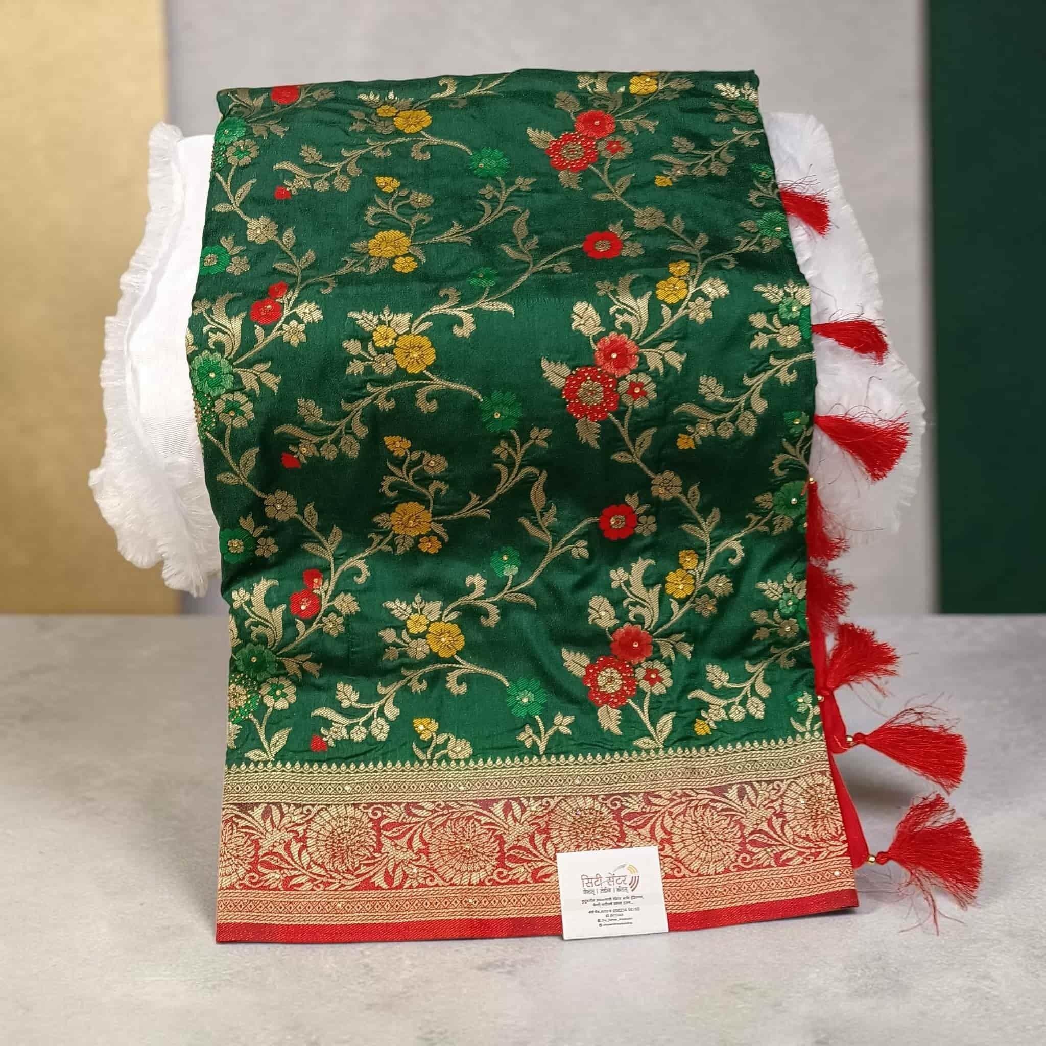 City Center Kathpadar Peshwai saree in deep green with floral embroidery, Swarovski crystals, and a red border.