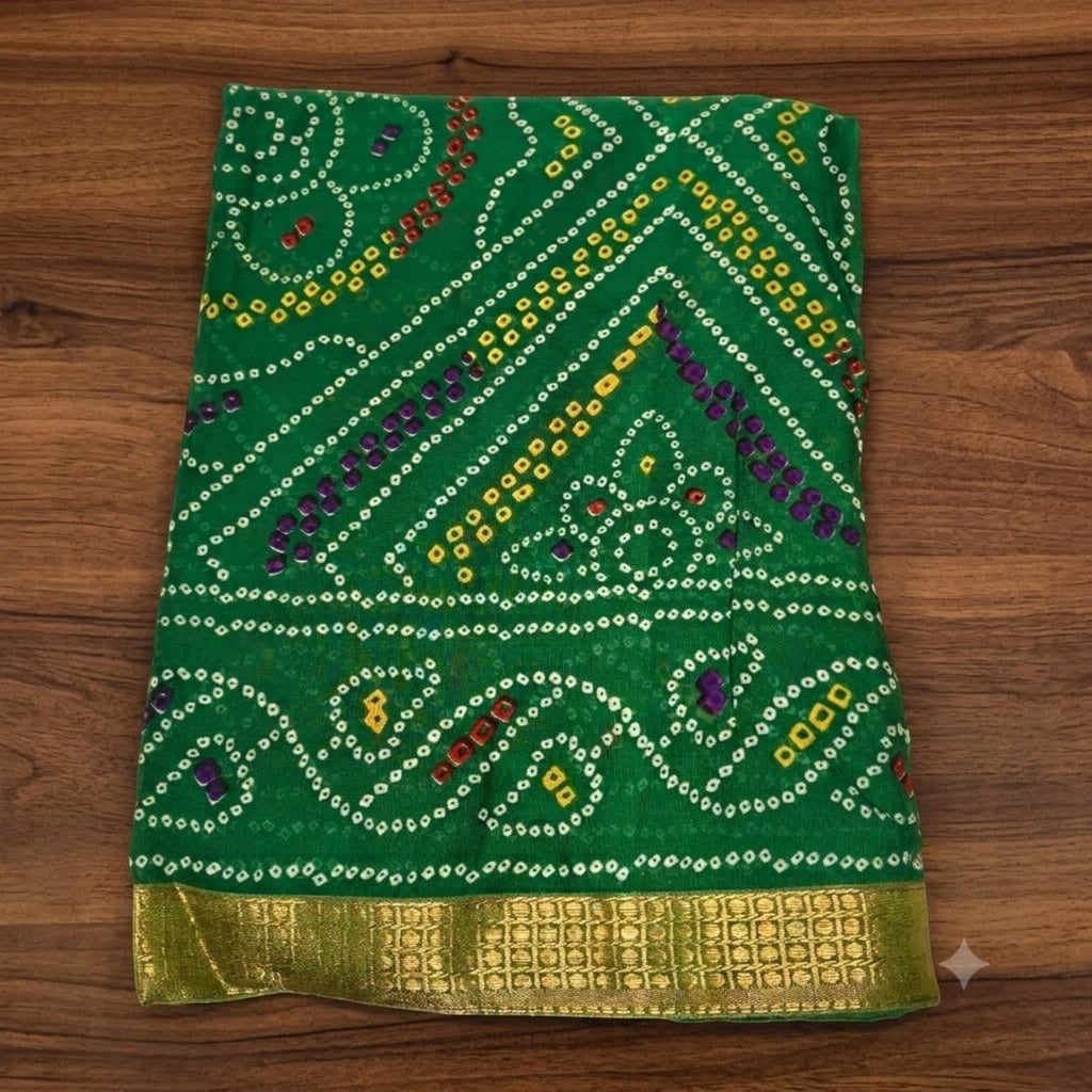City Center green silk Bandhan saree featuring traditional bandhani tie-dye patterns and a metallic gold border.